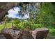 Cozy backyard sitting area overlooking a serene lake, ideal for enjoying the natural surroundings at 1504 E Gore St, Orlando, FL 32806
