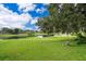 Expansive backyard with a view of the lake, perfect for relaxation and outdoor activities at 1504 E Gore St, Orlando, FL 32806