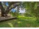 Backyard retreat with swing and scenic lake views from the deck at 1504 E Gore St, Orlando, FL 32806