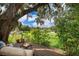 Enjoy serene lake views from the deck of this charming backyard at 1504 E Gore St, Orlando, FL 32806