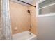 Bathroom featuring tiled shower with a small window at 1504 E Gore St, Orlando, FL 32806
