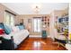 Cozy bedroom with hardwood floors and a classic design, offering a comfortable and private retreat at 1504 E Gore St, Orlando, FL 32806