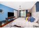 Relaxing bedroom featuring a bed with decorative pillows and natural light at 1504 E Gore St, Orlando, FL 32806