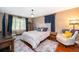 Cozy bedroom featuring a bed with decorative pillows and natural light at 1504 E Gore St, Orlando, FL 32806