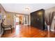 Open living room with hardwood floors, with easy access to other areas of the home at 1504 E Gore St, Orlando, FL 32806