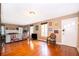 Bright living room featuring hardwood floors and a cozy fireplace, creating a warm and inviting atmosphere at 1504 E Gore St, Orlando, FL 32806