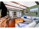 This living room has exposed beam ceilings, a large sectional sofa, and large windows at 1504 E Gore St, Orlando, FL 32806