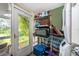 Functional mud room with laundry, shelving, and exterior access at 1504 E Gore St, Orlando, FL 32806