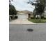 Lovely single-story home with a two-car garage and lush green lawn at 1574 Derby Glen Dr, Orlando, FL 32837