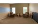 Spacious living room filled with natural light from two large windows at 1574 Derby Glen Dr, Orlando, FL 32837