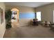 Spacious living room with neutral walls and carpet, and arched doorway at 1574 Derby Glen Dr, Orlando, FL 32837