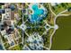 Aerial view showcasing the community pool, landscaping, and amenities surrounding the property at 1592 Carey Palm Cir, Kissimmee, FL 34747