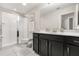 Neat bathroom featuring a glass-enclosed shower, vanity with storage, and neutral color scheme at 1592 Carey Palm Cir, Kissimmee, FL 34747