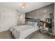 Stylish bedroom featuring a king-size bed, city view wall art and modern bedside tables at 1592 Carey Palm Cir, Kissimmee, FL 34747