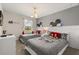 Charming bedroom featuring two twin beds, Mickey Mouse themed decor, and natural light at 1592 Carey Palm Cir, Kissimmee, FL 34747