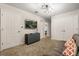 Cozy bonus room with a couch, mounted TV, and ample storage space at 1592 Carey Palm Cir, Kissimmee, FL 34747
