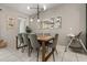 Elegant dining room featuring a stylish table set, modern lighting, and tile flooring at 1592 Carey Palm Cir, Kissimmee, FL 34747