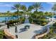 Lounge area with a fire pit surrounded by Adirondack chairs and lush landscaping at 1592 Carey Palm Cir, Kissimmee, FL 34747
