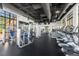 Community fitness center provides a variety of equipment for a full body workout with views from large windows at 1592 Carey Palm Cir, Kissimmee, FL 34747