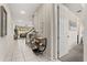Bright hallway featuring modern decor, tile flooring, and an open view of the living space at 1592 Carey Palm Cir, Kissimmee, FL 34747