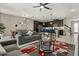 Open-concept living and dining area with modern decor and a view of the sleek kitchen at 1592 Carey Palm Cir, Kissimmee, FL 34747