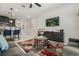 Open-concept living space with a modern TV, living area, and view of the kitchen at 1592 Carey Palm Cir, Kissimmee, FL 34747