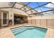 Enclosed backyard pool area featuring a safety fence and access to the covered patio at 1592 Carey Palm Cir, Kissimmee, FL 34747