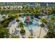 Aerial view of the community splash pad with slides, sprayers, and plenty of space for to cool off and have fun at 1592 Carey Palm Cir, Kissimmee, FL 34747