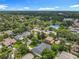 Aerial community view featuring manicured lawns, mature trees, a playground, and tennis courts in the neighborhood at 1640 Mayfield Ave, Winter Park, FL 32789