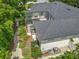 Aerial view of a home with a screened-in pool area and a large backyard at 1640 Mayfield Ave, Winter Park, FL 32789