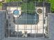 Aerial view of a screened-in pool and patio, and a lushly landscaped backyard at 1640 Mayfield Ave, Winter Park, FL 32789
