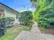 Backyard with stone path, gravel walk and string lights creating an enchanted ambiance at 1640 Mayfield Ave, Winter Park, FL 32789