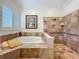 Bathroom featuring a jacuzzi tub, a shower, and a shuttered window to provide natural light at 1640 Mayfield Ave, Winter Park, FL 32789