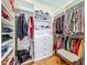 Walk-in closet featuring custom shelves, drawers and hanging rods for optimal storage solutions at 1640 Mayfield Ave, Winter Park, FL 32789