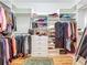 Well-organized walk-in closet with custom shelving and ample storage for clothing and accessories at 1640 Mayfield Ave, Winter Park, FL 32789