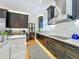 Gourmet kitchen featuring stainless steel appliances, white marble countertops, and custom cabinets at 1640 Mayfield Ave, Winter Park, FL 32789