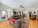 Living room with open access to the kitchen with hardwood floors and multiple seating options, including backyard access at 1640 Mayfield Ave, Winter Park, FL 32789