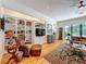 Living room features built-in shelving, hardwood floors, a comfortable seating area, and views of the backyard at 1640 Mayfield Ave, Winter Park, FL 32789