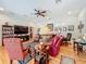 Open-concept living room with a ceiling fan, hardwood floors, and comfortable seating arrangement at 1640 Mayfield Ave, Winter Park, FL 32789