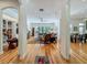 Spacious living room featuring hardwood floors, a ceiling fan, and large windows offering natural light at 1640 Mayfield Ave, Winter Park, FL 32789