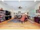 Bright living room showcasing hardwood floors, a ceiling fan, and ample space for entertainment at 1640 Mayfield Ave, Winter Park, FL 32789