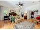 Spacious main bedroom with hardwood floors, large windows, ceiling fan and a walk-in closet at 1640 Mayfield Ave, Winter Park, FL 32789