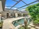 Large screened-in pool and patio area that's perfect for outdoor entertaining and relaxation at 1640 Mayfield Ave, Winter Park, FL 32789