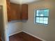 Additional room with a window offering views of the backyard, perfect for an office at 17836 Palm St, Umatilla, FL 32784