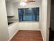 Cozy dining area with bay window, hardwood floors and built in storage at 17836 Palm St, Umatilla, FL 32784