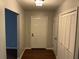 Welcoming entryway with a coat closet and a view of the front door at 17836 Palm St, Umatilla, FL 32784