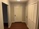 Inviting foyer featuring hardwood floors, coat closet and neutral decor at 17836 Palm St, Umatilla, FL 32784