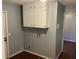 Practical laundry room with overhead cabinets and utility connections at 17836 Palm St, Umatilla, FL 32784