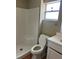 Bathroom features a walk-in shower, vanity, toilet and tile floors at 1809 Elm Ridge Ct, Orlando, FL 32808