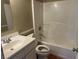 Bathroom with a vanity sink, tile floors, toilet, and shower-tub combo at 1809 Elm Ridge Ct, Orlando, FL 32808